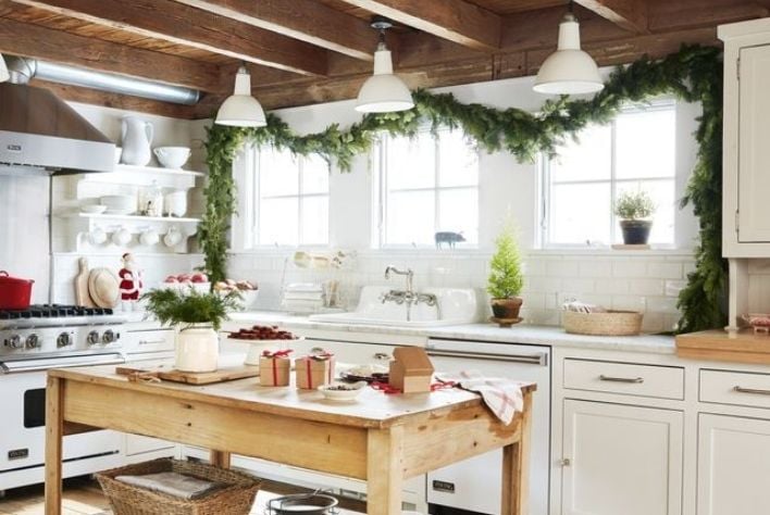 Green garland hanging above kitchen window.